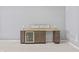 Bar area with granite counter, a sink, and a built-in mini fridge at 10795 Creekbed Cir, Fishers, IN 46038