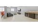 Basement with bar area, kitchen area, and lounge with a modern design at 10795 Creekbed Cir, Fishers, IN 46038