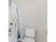 Toilet and shower with decorative shower curtain at 10795 Creekbed Cir, Fishers, IN 46038