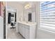 Bright bathroom with double vanity, and a tiled floor at 10795 Creekbed Cir, Fishers, IN 46038