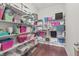 Walk-in closet with custom shelving for storage and organization at 10795 Creekbed Cir, Fishers, IN 46038