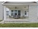 Inviting front porch with stone accents, comfortable seating, and a ceiling fan at 10795 Creekbed Cir, Fishers, IN 46038