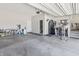 Spacious garage with ample storage, bike racks, and access door at 10795 Creekbed Cir, Fishers, IN 46038