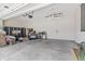 This garage includes ample storage space and a concrete floor at 10795 Creekbed Cir, Fishers, IN 46038