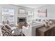 Bright living room features a fireplace, hardwood floors, and comfortable seating at 10795 Creekbed Cir, Fishers, IN 46038