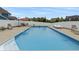 Backyard swimming pool with lounge chairs and dining area, perfect for outdoor entertaining at 10795 Creekbed Cir, Fishers, IN 46038