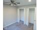 Bedroom with neutral carpet, ceiling fan, and closet perfect for storage at 1155 E Perry St, Indianapolis, IN 46227