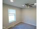 Comfortable bedroom featuring neutral tones, carpet, and window with blinds at 1155 E Perry St, Indianapolis, IN 46227