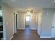 Hallway featuring contemporary flooring and convenient access to multiple rooms at 1155 E Perry St, Indianapolis, IN 46227