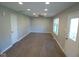 Spacious living room with ceiling fan, recessed lighting, and new flooring at 1155 E Perry St, Indianapolis, IN 46227