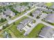 Aerial view showcasing community, pond, landscaping, and neatly arranged homes at 1158 Thistlewood Way, Plainfield, IN 46168