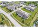 A high angle shot of a townhouse community with orderly landscaping on a bright, sunny day at 1158 Thistlewood Way, Plainfield, IN 46168
