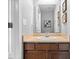 Cozy bathroom with wood vanity, framed mirror and playful decor creates a warm and inviting space at 1158 Thistlewood Way, Plainfield, IN 46168