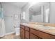 Neutral bathroom features a double sink vanity with wood cabinets and a standard toilet at 1158 Thistlewood Way, Plainfield, IN 46168