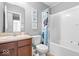 Neutral bathroom features a wood vanity, standard toilet and shower/tub combo at 1158 Thistlewood Way, Plainfield, IN 46168
