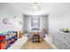 Bright bedroom features soft carpet, neutral paint and playful decor at 1158 Thistlewood Way, Plainfield, IN 46168