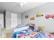 Cozy bedroom featuring neutral gray walls, white trim and Paw Patrol bedding at 1158 Thistlewood Way, Plainfield, IN 46168