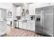 Modern kitchen featuring stainless steel appliances, white cabinets, and sleek countertops at 1158 Thistlewood Way, Plainfield, IN 46168