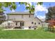 Expansive backyard featuring a large lawn, patio seating area, pergola, and play equipment at 1202 Vestman Ct, Greenwood, IN 46143