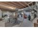 Spacious unfinished basement with exposed ceiling beams, concrete floor, ping pong table, and utilities at 1202 Vestman Ct, Greenwood, IN 46143