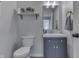 Bathroom featuring a modern vanity with storage, a mirror, and a toilet at 1202 Vestman Ct, Greenwood, IN 46143