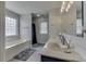 Bright bathroom with double vanity, bathtub, and shower at 1202 Vestman Ct, Greenwood, IN 46143