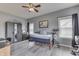 Neutral toned bedroom with gray accents and ceiling fan at 1202 Vestman Ct, Greenwood, IN 46143