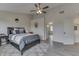 Bedroom featuring a comfortable bed with gray bedding, and a ceiling fan at 1202 Vestman Ct, Greenwood, IN 46143