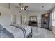 Bedroom with a bed, ceiling fan, and dresser with mirror at 1202 Vestman Ct, Greenwood, IN 46143