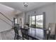 Well-lit dining room featuring a table with seating, views of the foyer, and neutral decor at 1202 Vestman Ct, Greenwood, IN 46143