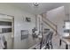 Cozy dining area featuring a table with seating for six, neutral decor, and views of the staircase at 1202 Vestman Ct, Greenwood, IN 46143