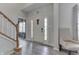 Bright foyer with hardwood flooring, staircase, and neutral paint at 1202 Vestman Ct, Greenwood, IN 46143