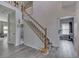 Spacious foyer with hardwood flooring, a staircase, and an open floor plan at 1202 Vestman Ct, Greenwood, IN 46143