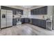 Modern kitchen featuring stainless steel appliances and dark cabinetry at 1202 Vestman Ct, Greenwood, IN 46143