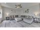 Comfortable living room featuring a plush sofa, neutral decor, and hardwood flooring at 1202 Vestman Ct, Greenwood, IN 46143
