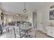 Open concept living room area with a large sectional, and dining area at 1202 Vestman Ct, Greenwood, IN 46143