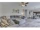 Spacious living room featuring a comfortable gray sectional sofa and neutral decor at 1202 Vestman Ct, Greenwood, IN 46143