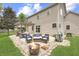 Outdoor patio with comfortable seating, a pergola, a fire pit, and a well-manicured lawn at 1202 Vestman Ct, Greenwood, IN 46143