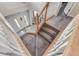 Carpeted staircase with wooden banister leading to the front door at 1202 Vestman Ct, Greenwood, IN 46143