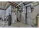 Basement utility area shows the water heater, filter and furnace at 1202 Vestman Ct, Greenwood, IN 46143