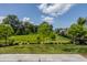 Picture perfect backyard with lovely landscaping and beautiful blue skies at 12022 Otto Ln, Carmel, IN 46032