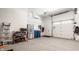 Spacious garage with epoxy floors, storage, and access to the home at 12022 Otto Ln, Carmel, IN 46032