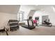 Bright home gym with natural light, a treadmill, weights, and exercise bike at 12022 Otto Ln, Carmel, IN 46032