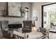 Stylish living space with a modern fireplace, comfortable seating, and sliding glass doors at 12022 Otto Ln, Carmel, IN 46032