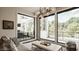 Bright living room with modern lighting, large windows, and stylish furniture at 12022 Otto Ln, Carmel, IN 46032