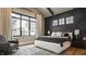 Spacious main bedroom featuring a dark accent wall and large windows at 12022 Otto Ln, Carmel, IN 46032