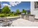 Outdoor kitchen featuring stainless steel built-in grill with prep and dining space at 12022 Otto Ln, Carmel, IN 46032