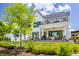 Stunning modern farmhouse exterior with an expansive patio and outdoor living spaces at 12022 Otto Ln, Carmel, IN 46032