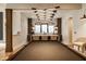 Wet bar area features modern pendant lighting, bar seating, and dark wood cabinetry at 12022 Otto Ln, Carmel, IN 46032