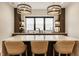 Wet bar features a quartz countertop, pendant lights, and open shelves with drinkware displays at 12022 Otto Ln, Carmel, IN 46032